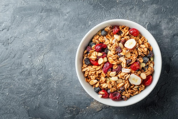 Photo homemade granola in white bowl gray background top view muesli bowl for healthy breakfast