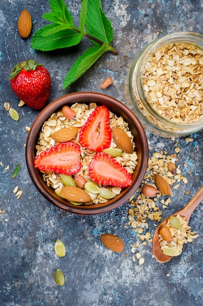 Homemade  granola with fresh strawberries 