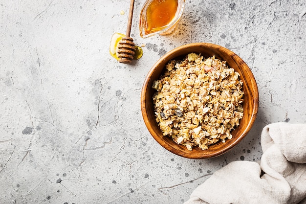 Homemade Granola with oat, honey and nuts in a bowl