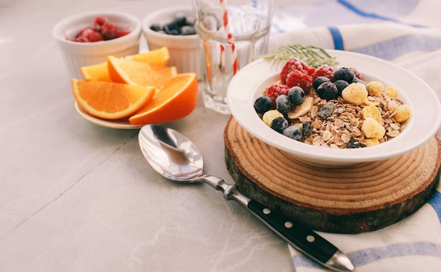 homemade granola with raspberries and blueberries