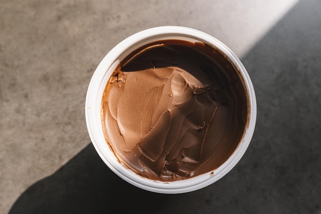 homemade hazelnut spread in plastic bowl. Hazelnut Nougat cream.