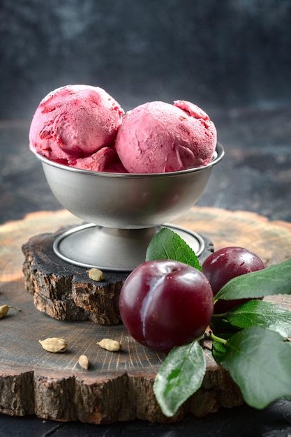 Homemade ice cream made from red plums with cardamom