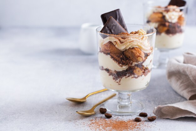 Homemade Italian dessert tiramisu with savoiardi and mascarpone. Selective focus.