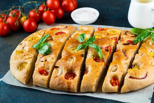 Homemade Italian Focaccia with basil and tomatoes Italian food Italian bread