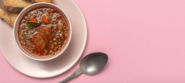 Homemade lentil stew with vegetables and chorizo