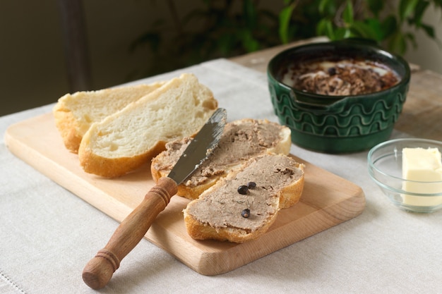 Homemade liver pate with bread and butter. Rustic style.