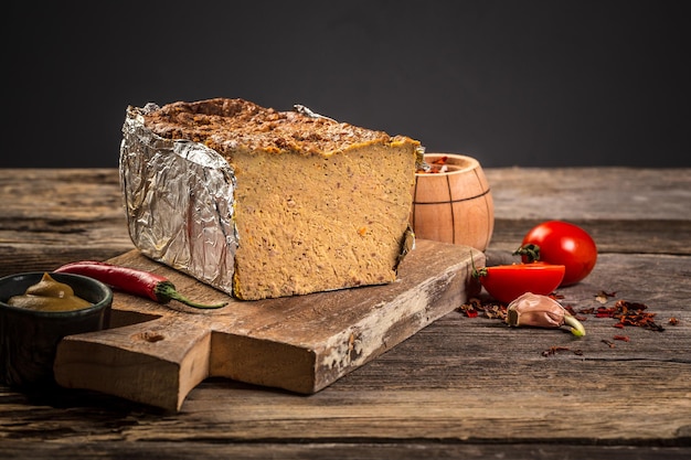 Homemade liver pate on wooden board place for text