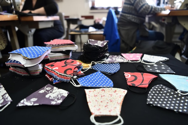 Homemade Manufacturing Of Protective Trendy Medical Face Mask. Tailor Woman Sewing With Machine At Home, Healthcare New Normal Concept In Coronavirus Covid19 Lockdown