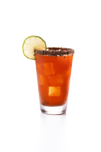 Homemade michelada cocktail with beer lime juicehot saucesalted Rim and tomato juice isolated