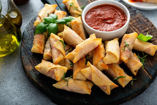 Homemade mozzarella and salami sticks with marinara