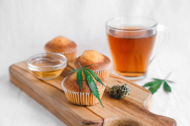 Homemade muffin with CBD cannabis and leaf garnish Treatment of medical marijuana for use in food