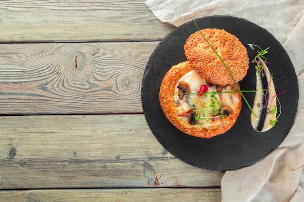 Homemade mushroom cream soup, served in bread bowl