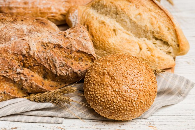 Homemade natural breads Different kinds of fresh bread as background perspective view with copy space