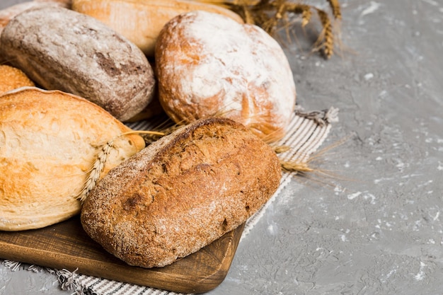 Homemade natural breads Different kinds of fresh bread as background perspective view with copy space