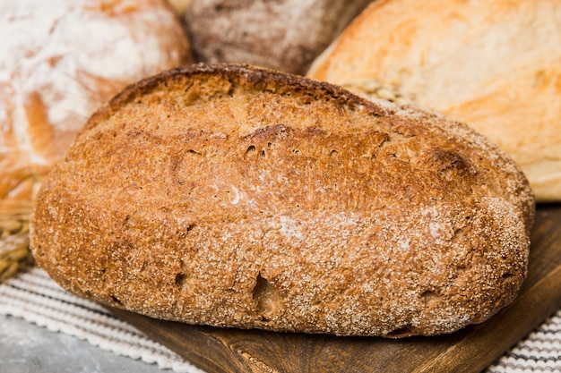 Homemade natural breads Different kinds of fresh bread as background perspective view with copy space