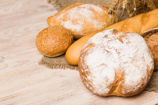 Homemade natural breads Different kinds of fresh bread as background perspective view with copy space