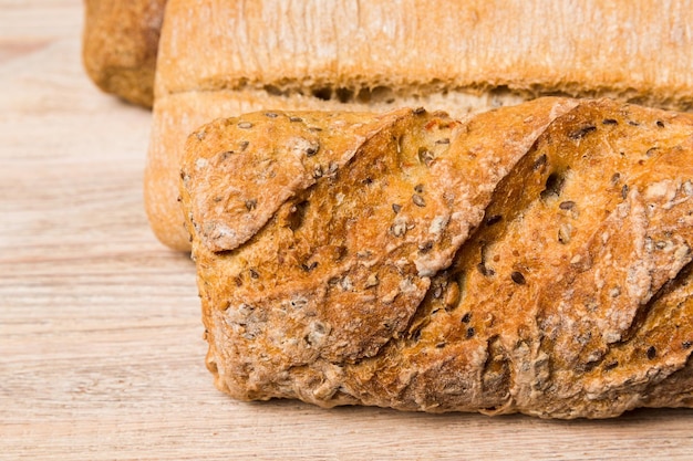 Homemade natural breads Different kinds of fresh bread as background perspective view with copy space