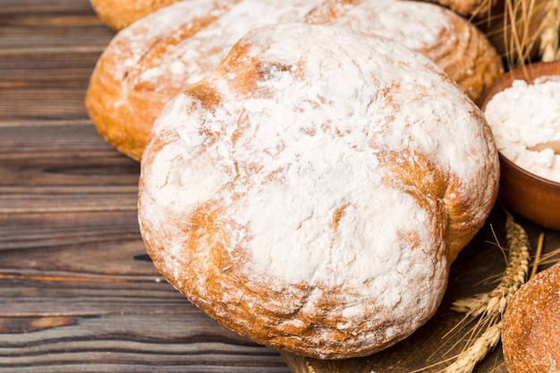 Homemade natural breads Different kinds of fresh bread as background perspective view with copy space