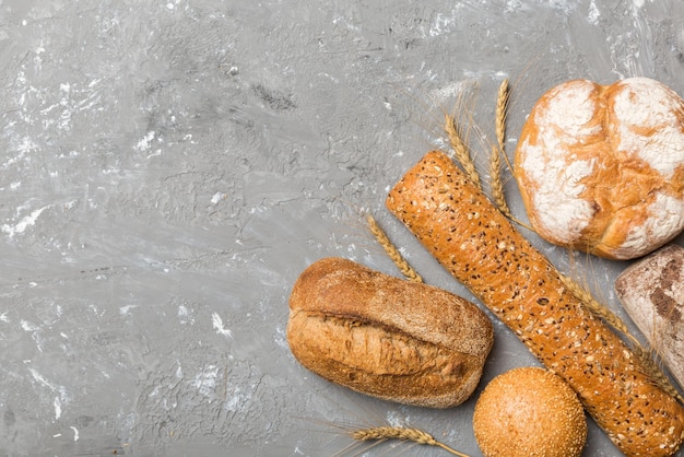 Homemade natural breads Different kinds of fresh bread as background top view with copy space