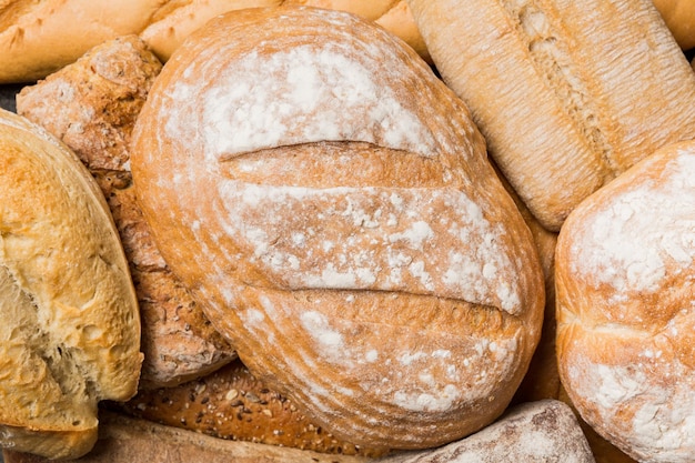 Homemade natural breads Different kinds of fresh bread as background top view with copy space