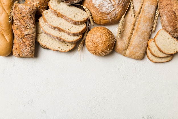 Homemade natural breads Different kinds of fresh bread as background top view with copy space