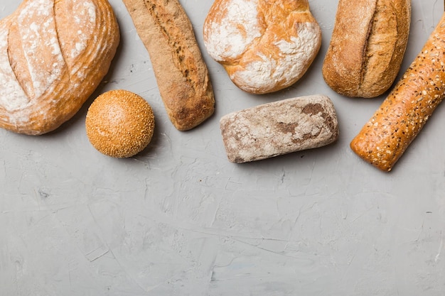 Homemade natural breads Different kinds of fresh bread as background top view with copy space