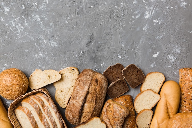 Homemade natural breads Different kinds of fresh bread as background top view with copy space