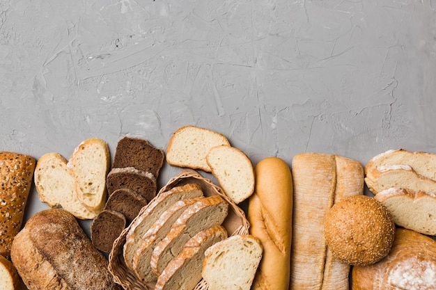 Homemade natural breads Different kinds of fresh bread as background top view with copy space