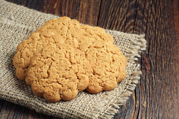 Homemade oatmeal cookies on rustic wooden table