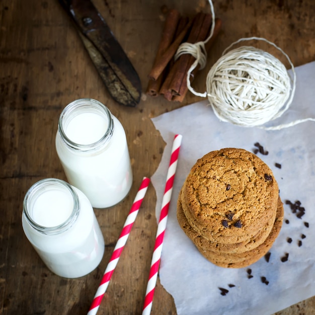 Homemade oatmeal cookies with chocolate and milk