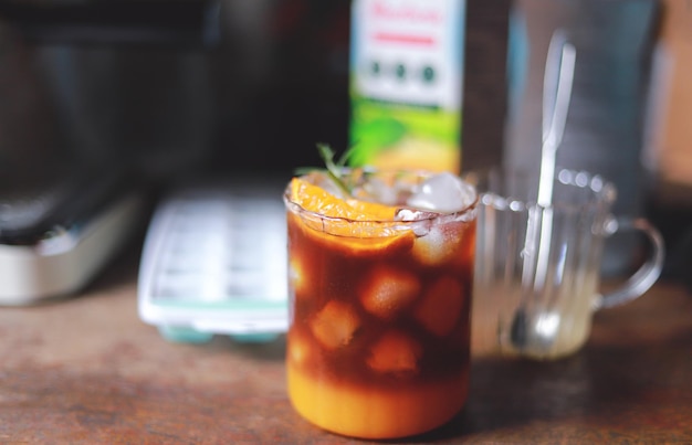 Homemade orange Americano coffee from free time making drink for healthy living life selective focus