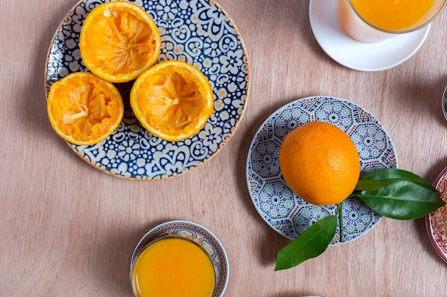 Homemade orange juice from above on wooden table