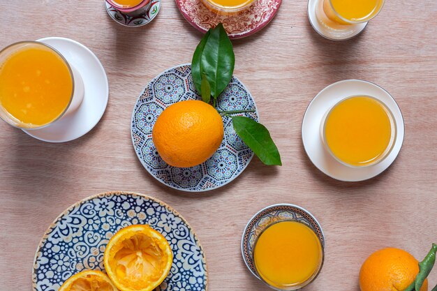 Homemade orange juice from above on wooden table