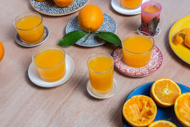 Homemade orange juice from above on wooden table