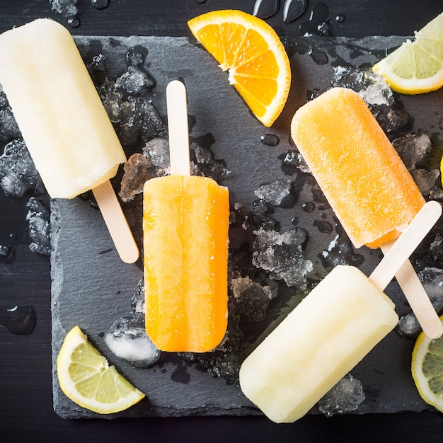 Homemade orange and lemon popsicles