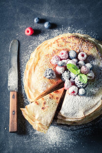 Homemade pancakes cake with blueberries and raspberries