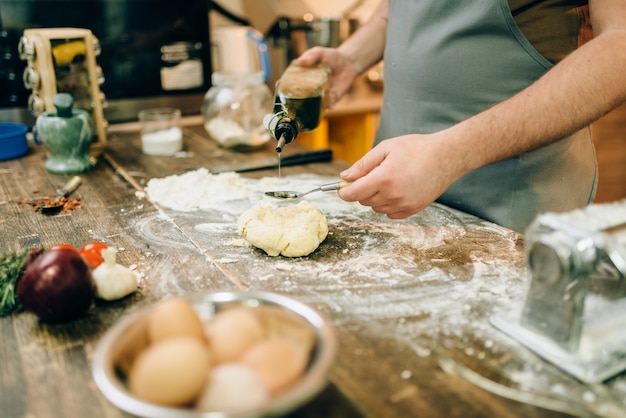 Homemade pasta cooking, dough preparation on table