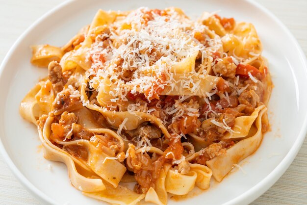 Homemade pasta fettuccine bolognese with cheese - Italian food style