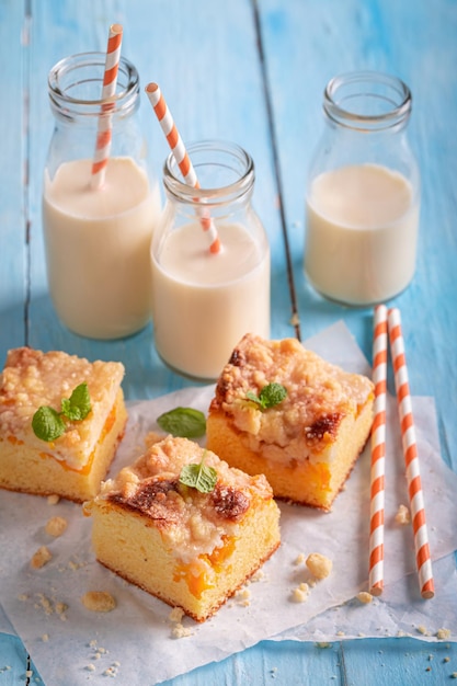 Homemade peach cake with glaze Served with milk