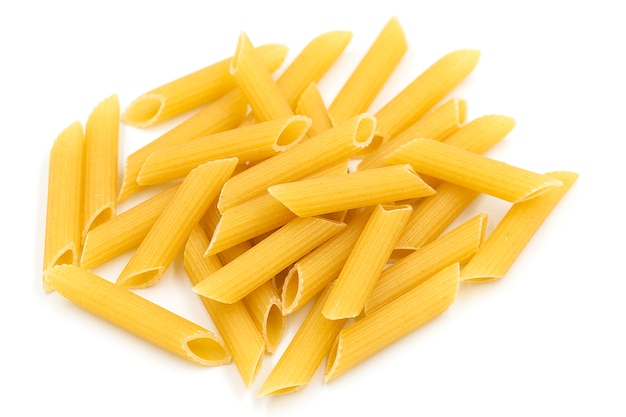 Homemade penne pasta on white background