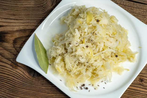 Homemade pickled sauerkraut on a white plate