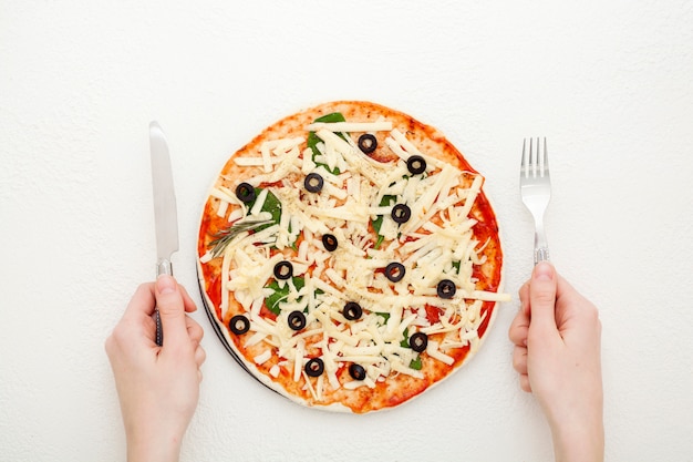 Homemade pizza with olives on a white background