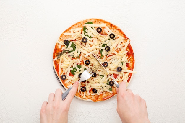 Homemade pizza with olives on a white background