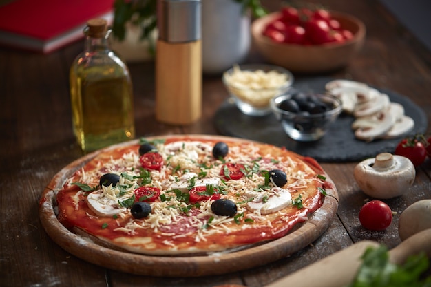 Homemade Pizza on wooden board