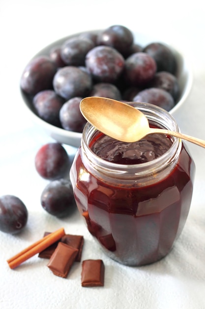 Homemade plum jam with chocolate and cinnamon 