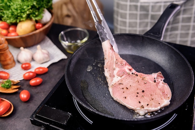 Homemade pork chop steak with salad. Online learning for cooking diet and healthy food when stay at home during Coronavirus.