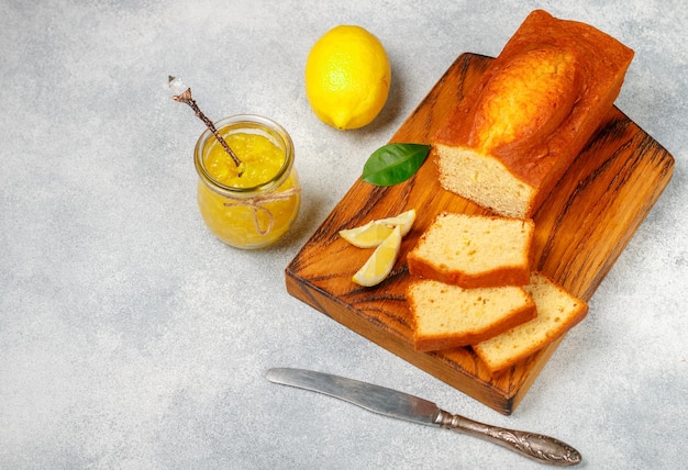 Homemade pound cake with lemon and jam Traditional treat for tea Citrus loaf cake Selective focus