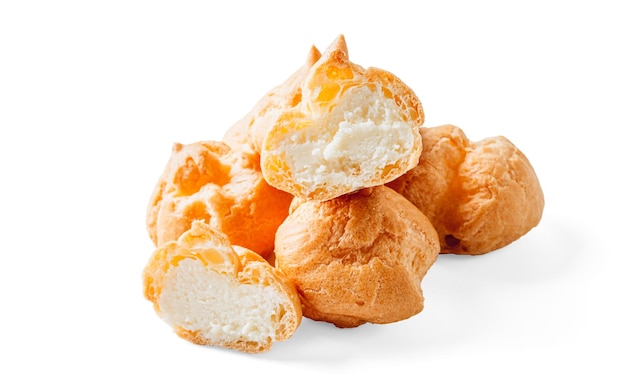 Homemade profiteroles with ricotta cream isolated on a white background