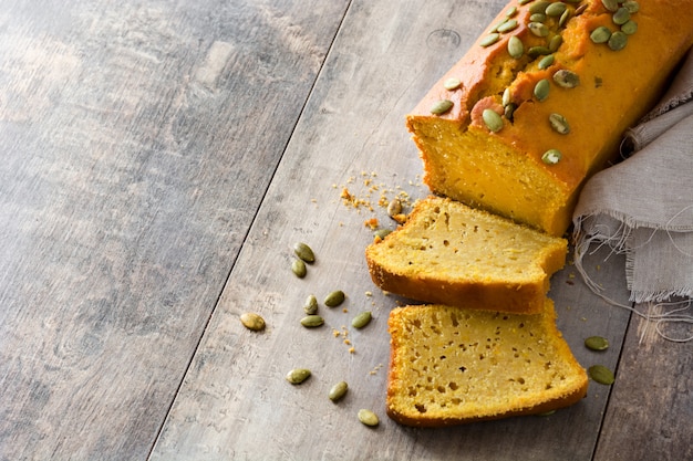 Homemade pumpkin bread on wooden table