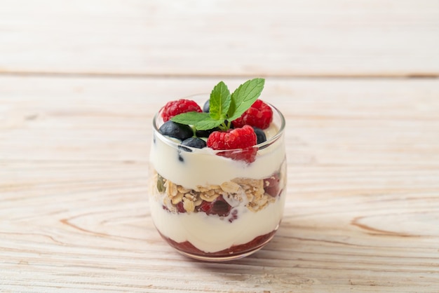 homemade raspberry and blueberry with yogurt and granola - healthy food style